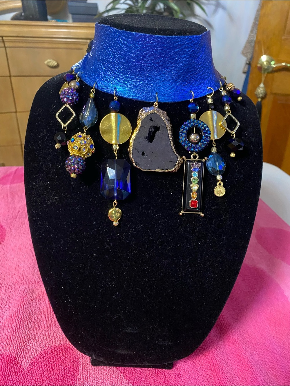 Statement Black and Blue Charm Necklace with Gold Accents